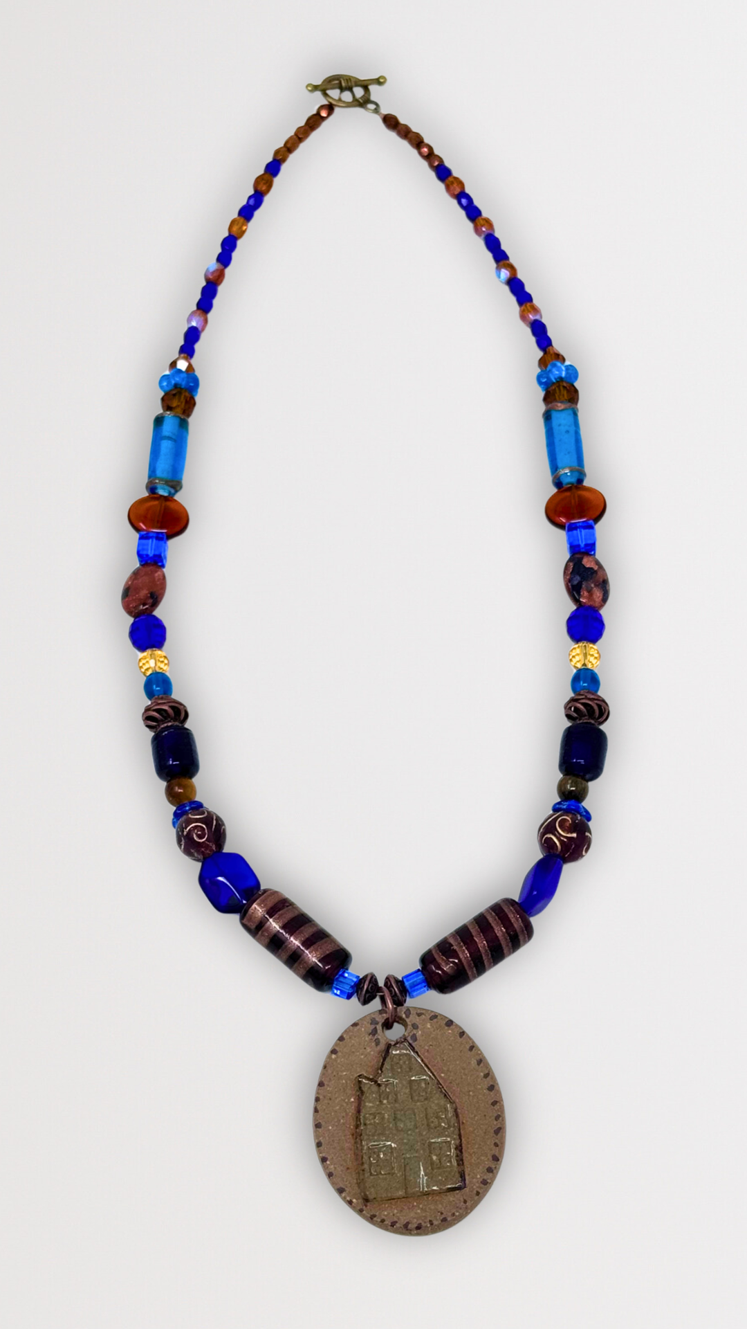 Beaded Necklace with Ceramic House Pendant